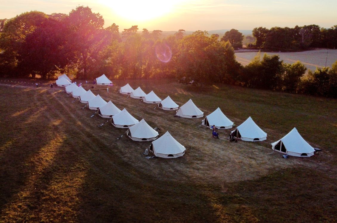 Bell tents at sunset in the Kent countryside